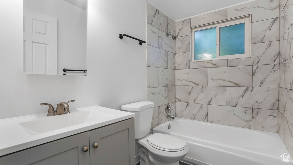 Bathroom with vanity and  shower combination