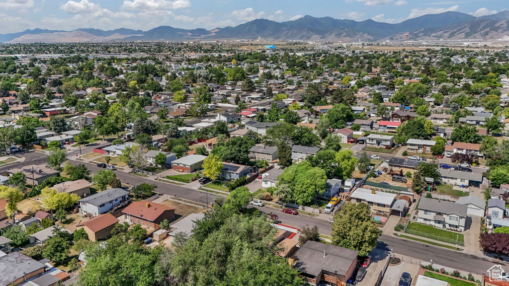 Aerial view of residential area featuring a mountain backdrop