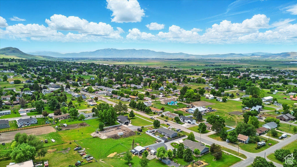 Aerial perspective of suburban area with a mountainous background