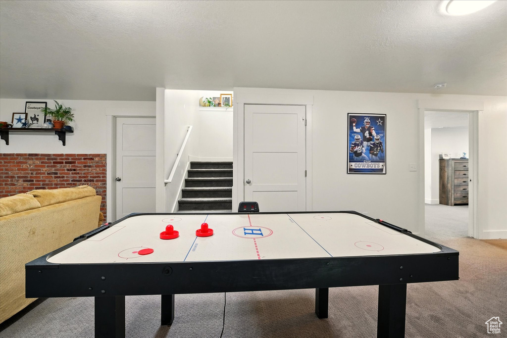 Playroom with carpet floors and baseboards