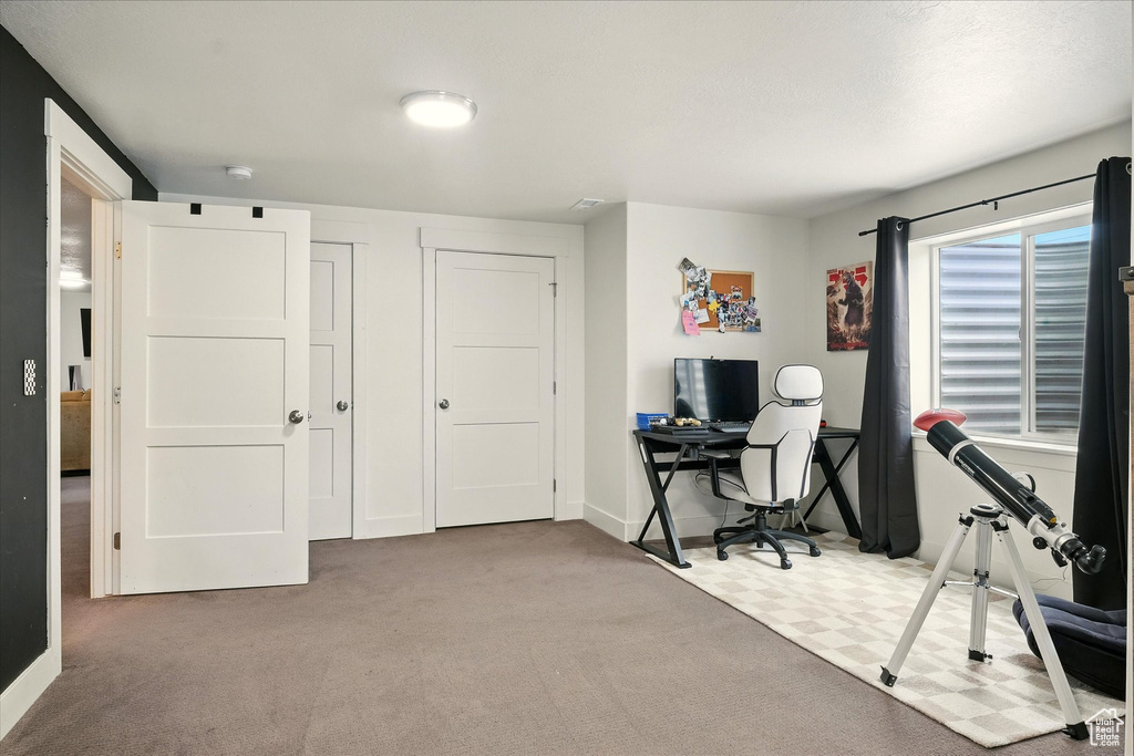 Office area featuring carpet flooring and baseboards
