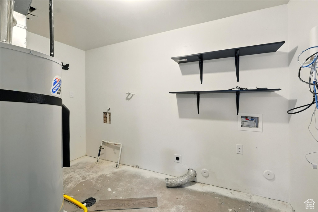 Laundry room with gas dryer hookup, hookup for an electric dryer, hookup for a washing machine, and water heater