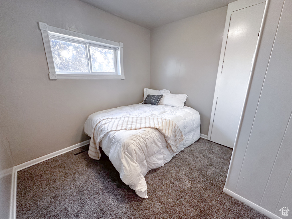 Carpeted bedroom with baseboards