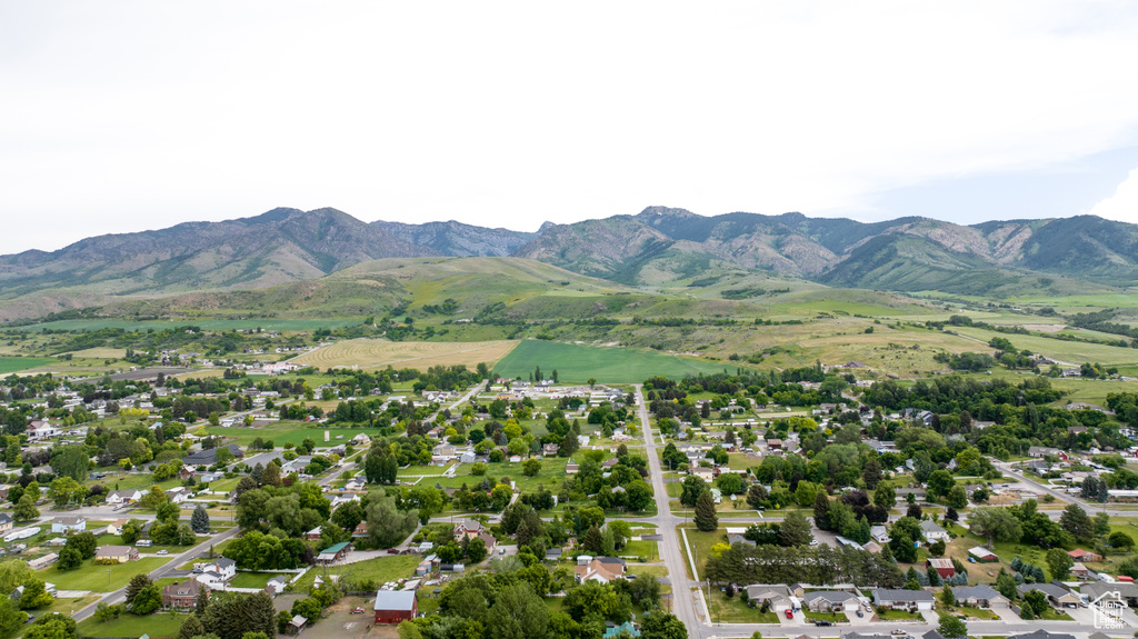 Aerial view of property's location with a mountainous background