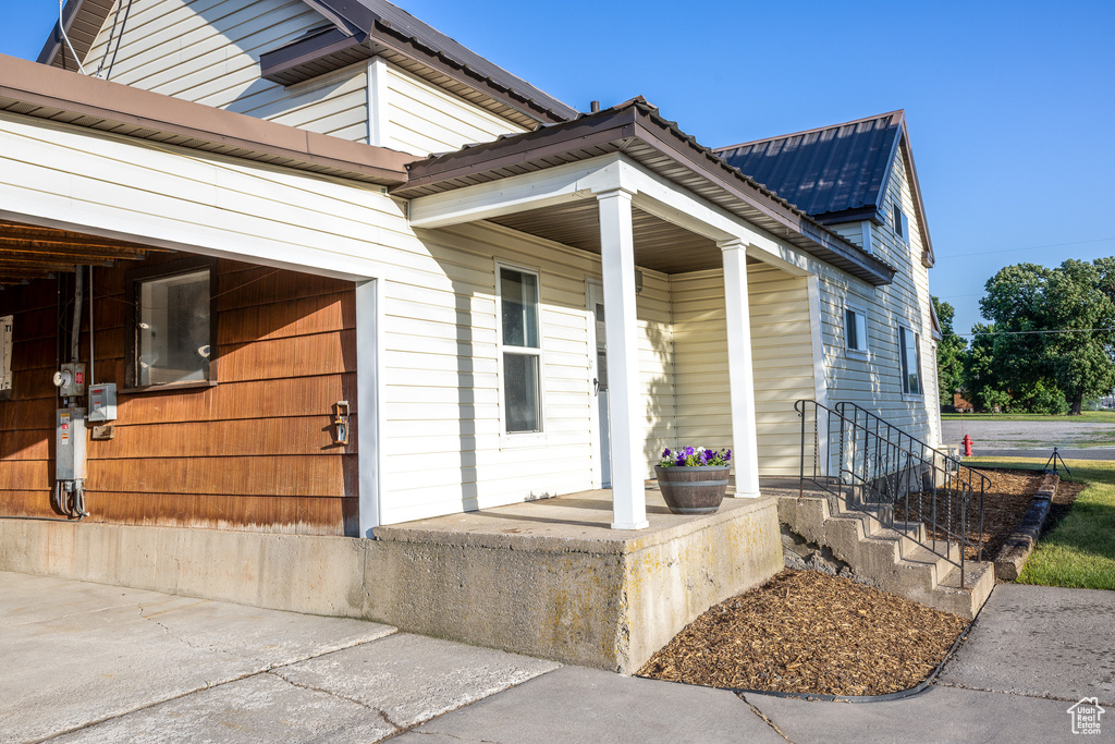 Entrance to property featuring a metal roof