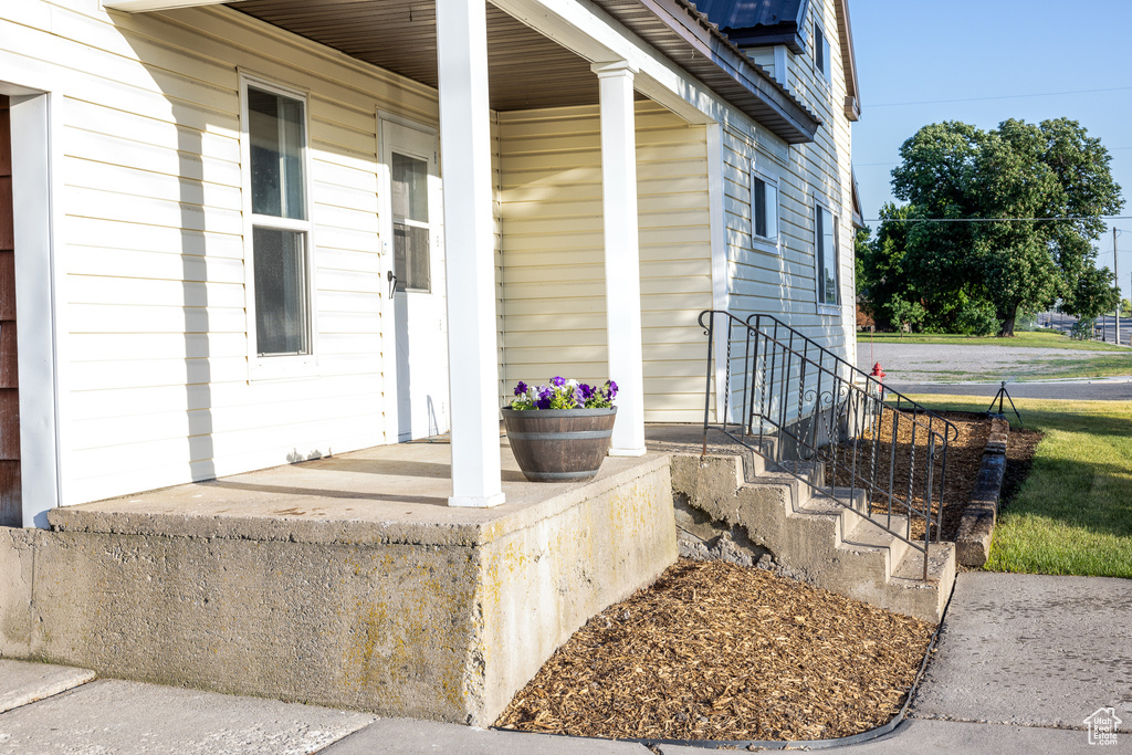 Entrance to property featuring a porch