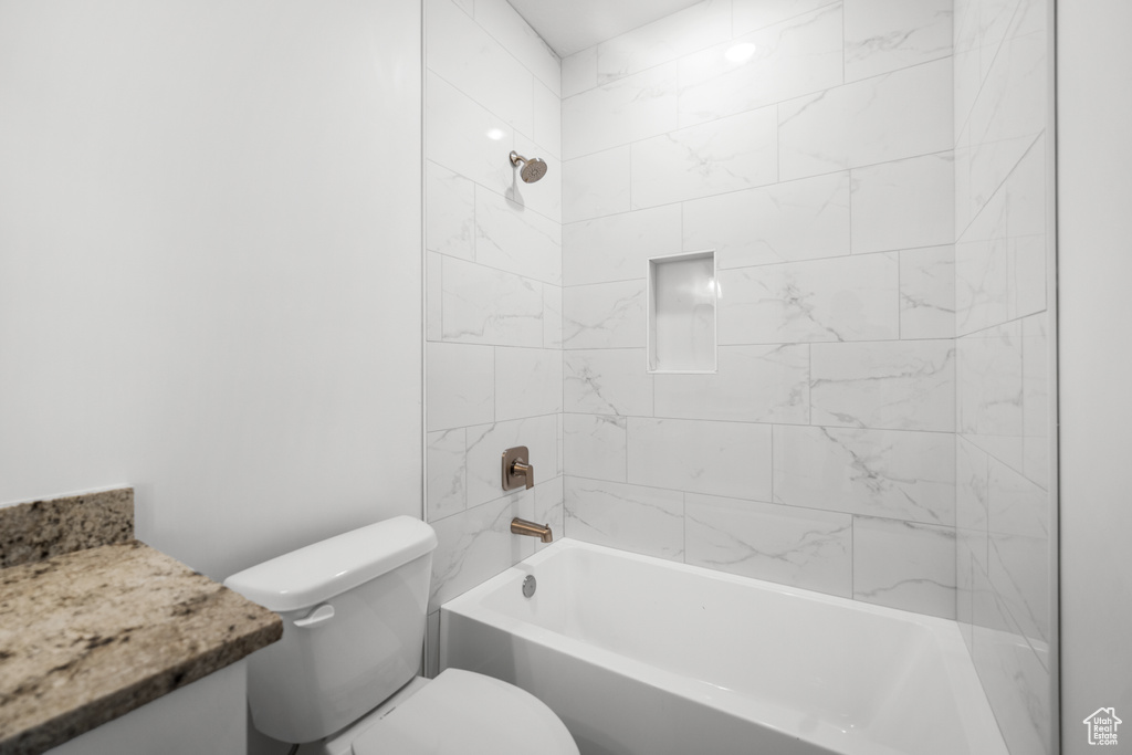 Bathroom with vanity and shower / bath combination