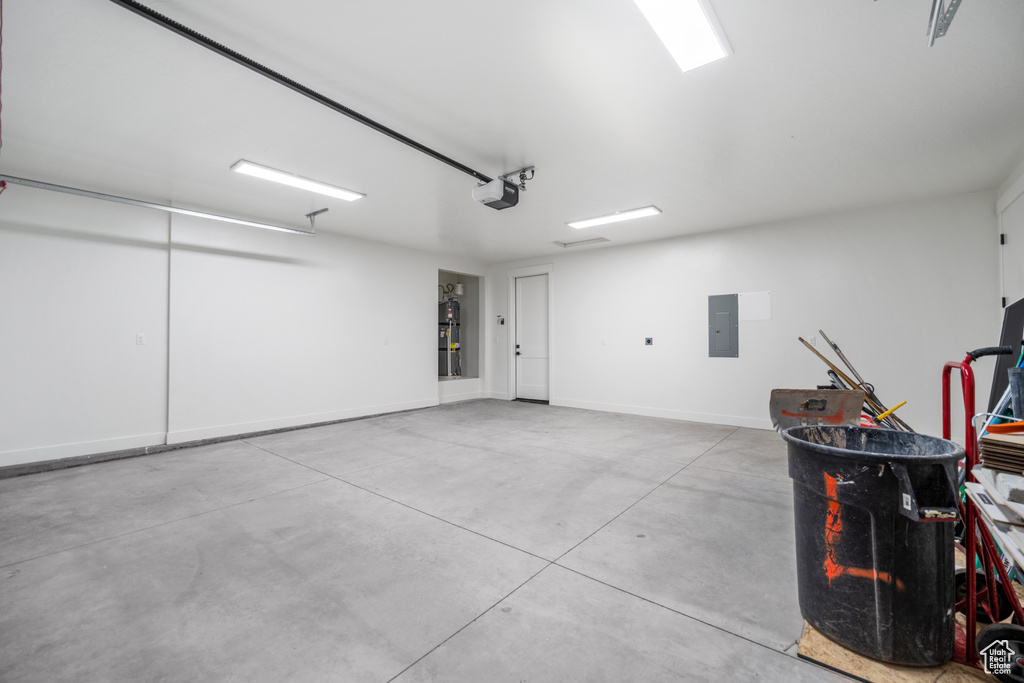 Garage with a garage door opener and electric panel