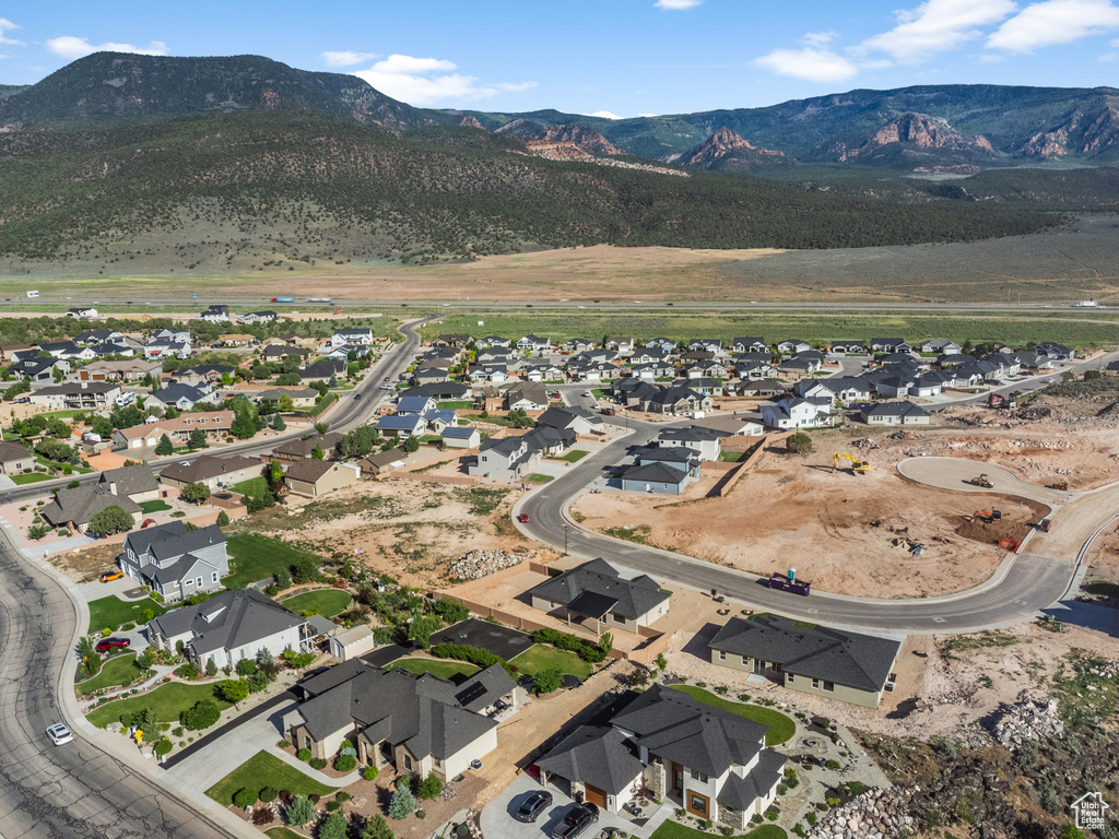 View of property location featuring a mountain backdrop and nearby suburban area