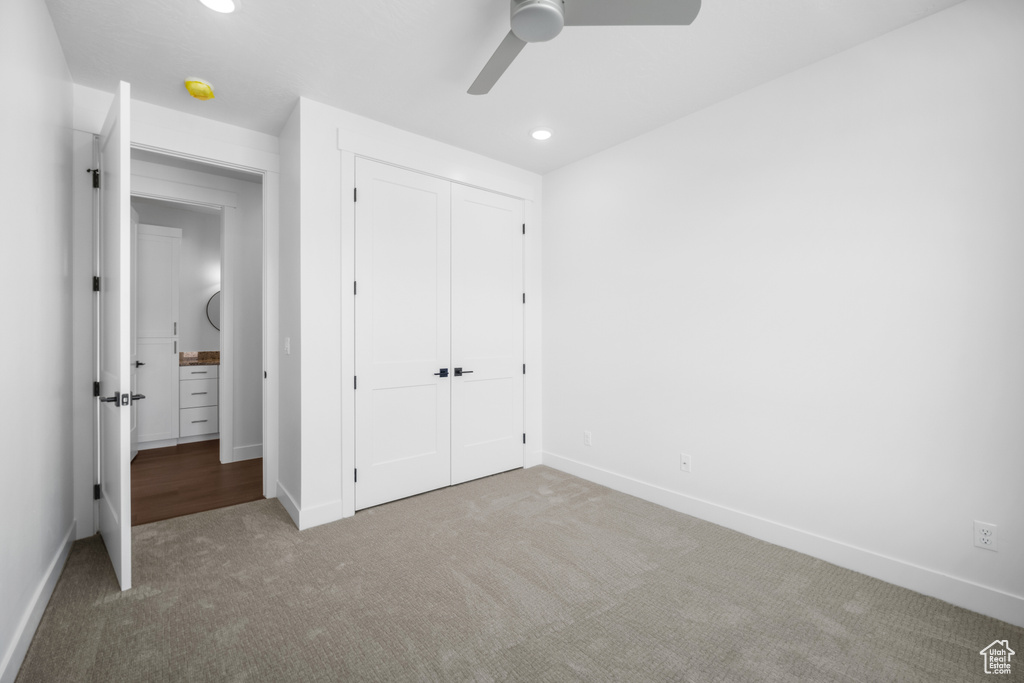 Unfurnished bedroom with carpet, a closet, recessed lighting, and a ceiling fan