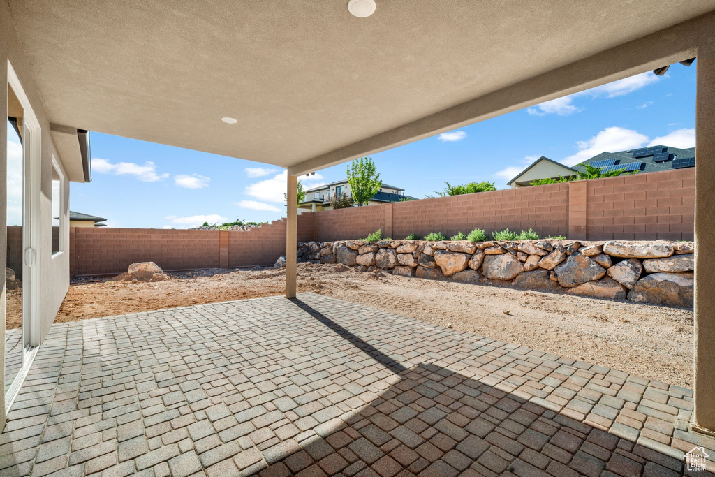 Fenced backyard featuring a patio area