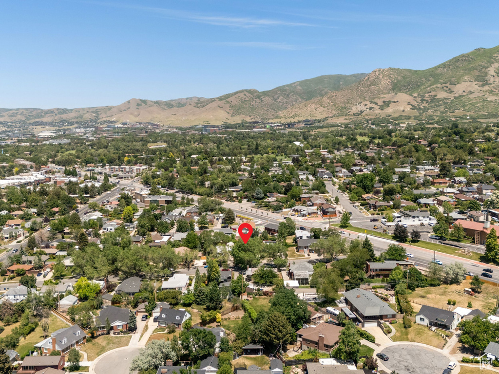 Aerial view of property and surrounding area with nearby suburban area