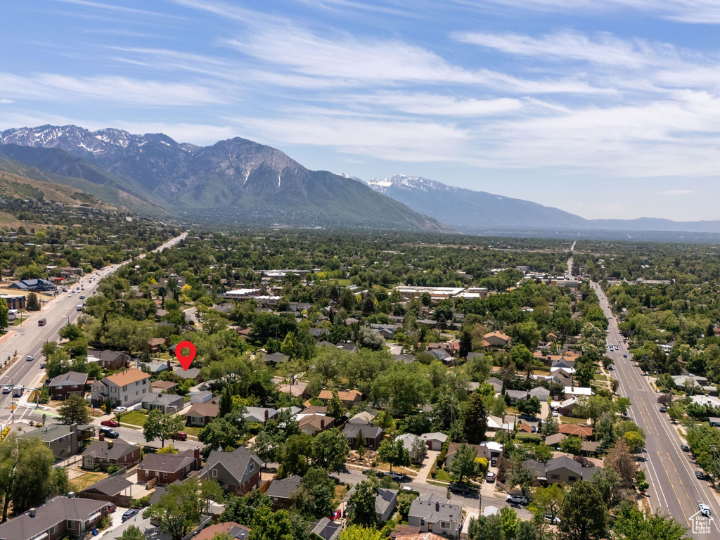 Aerial perspective of suburban area with a mountainous background