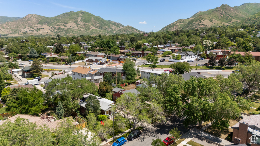 Aerial perspective of suburban area with a mountain backdrop