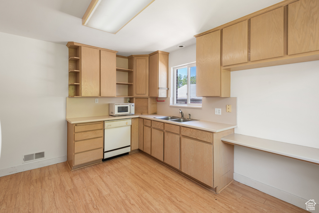 Kitchen with white appliances, open shelves, light wood-style flooring, and light brown cabinets