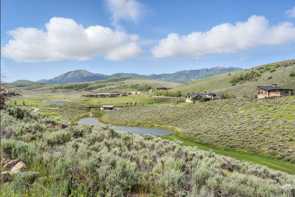 View of mountain background featuring rural landscape
