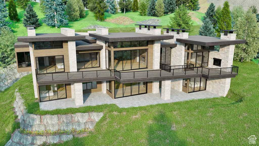 Rear view of property with a patio area, stone siding, and a yard