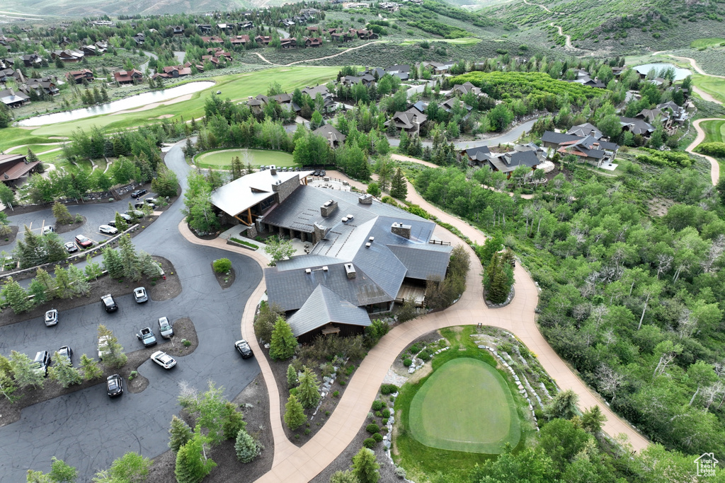Aerial overview of property\\\\\\\'s location with a golf course and nearby suburban area