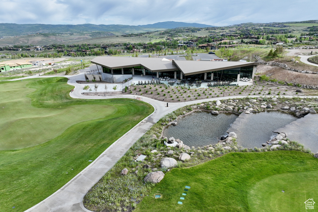 Bird\\\\\\\'s eye view of a mountain backdrop and a golf club