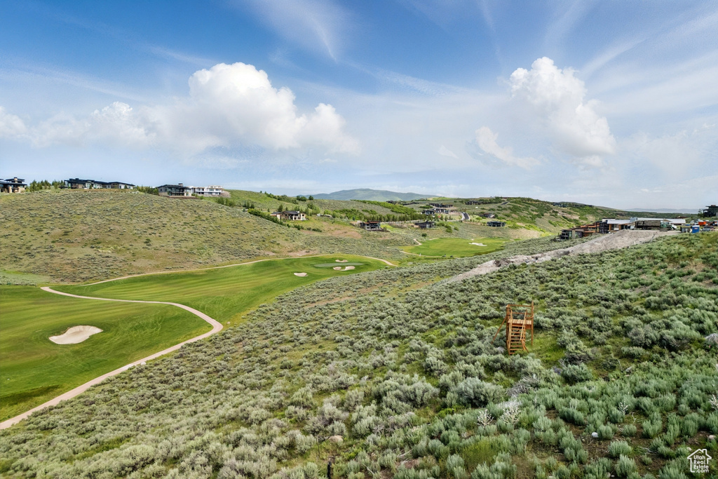 View of community with golf course view and a mountain view