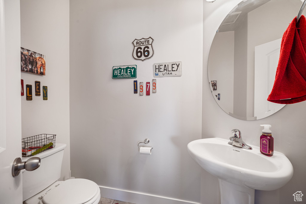 Half bath with toilet and a sink