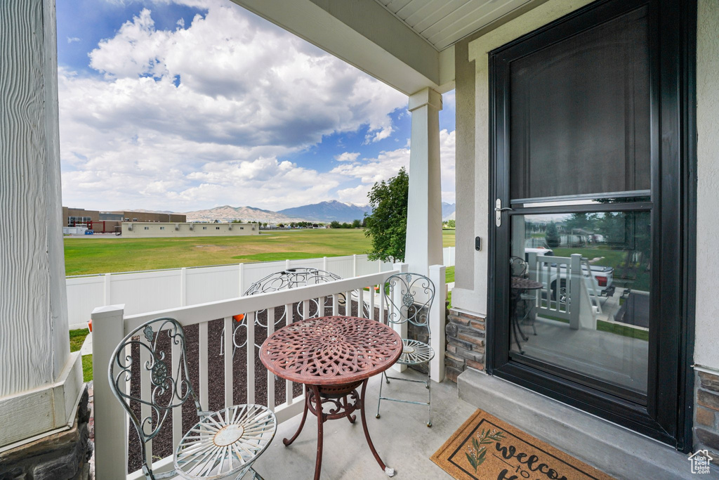 Porch featuring a mountain view