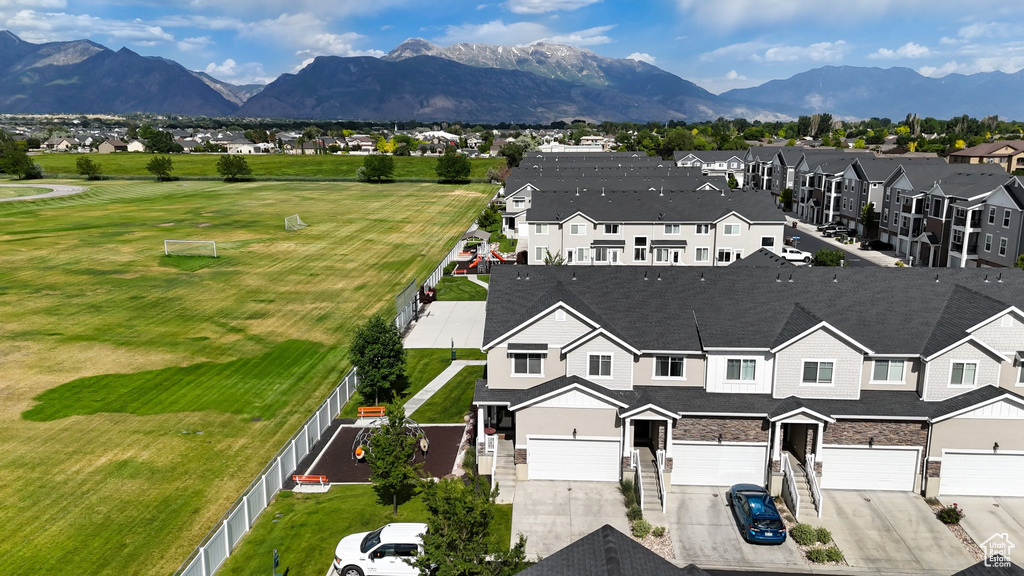 Aerial view of residential area featuring a mountain backdrop