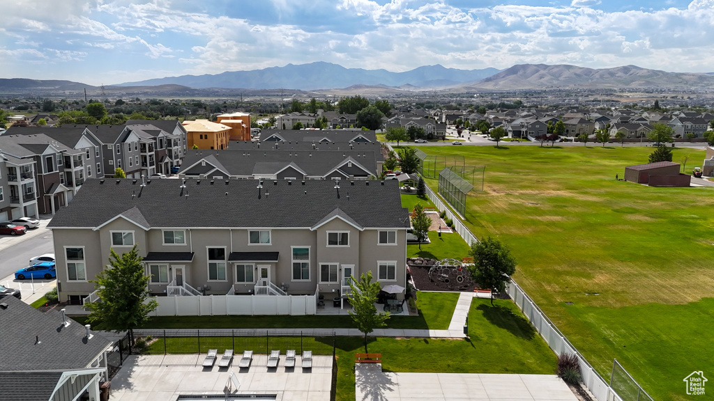 Aerial perspective of suburban area featuring a mountain backdrop