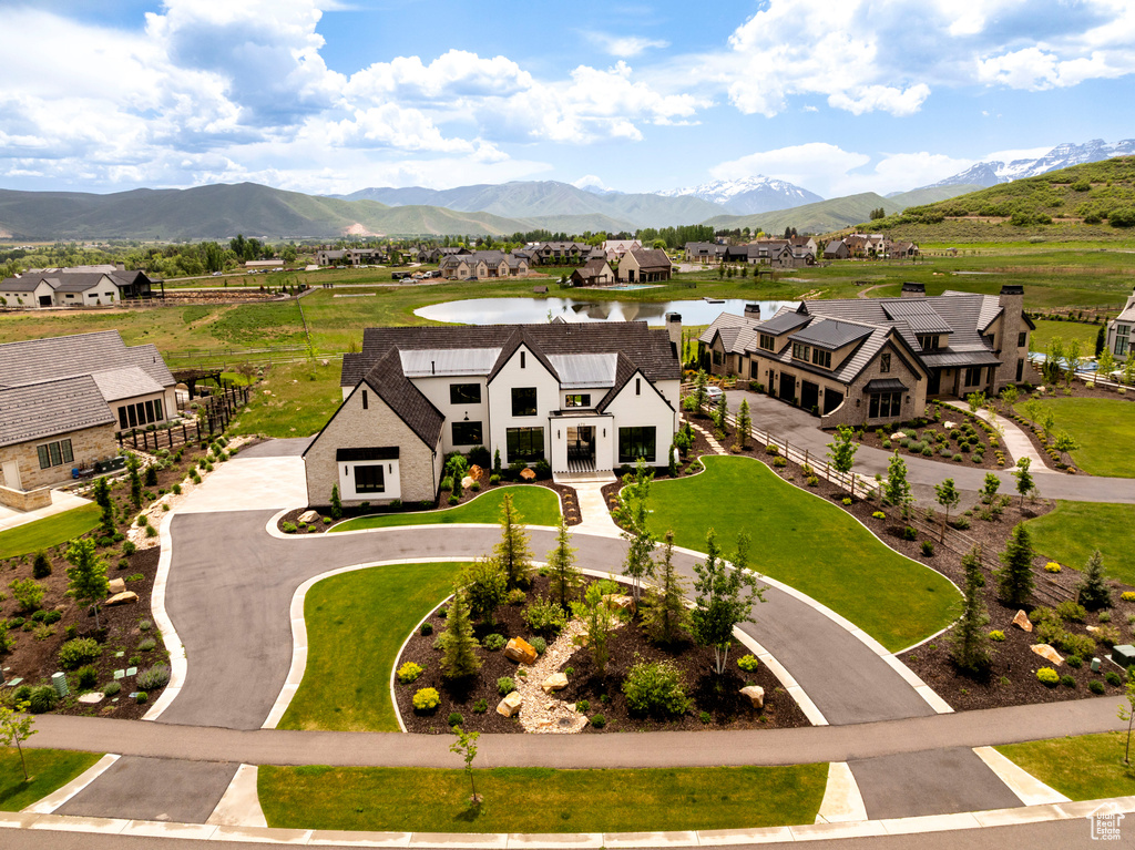 Aerial perspective of suburban area featuring a water and mountain view
