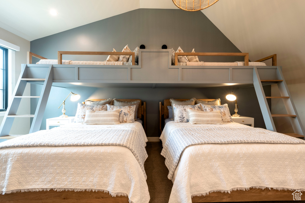 Bedroom featuring lofted ceiling