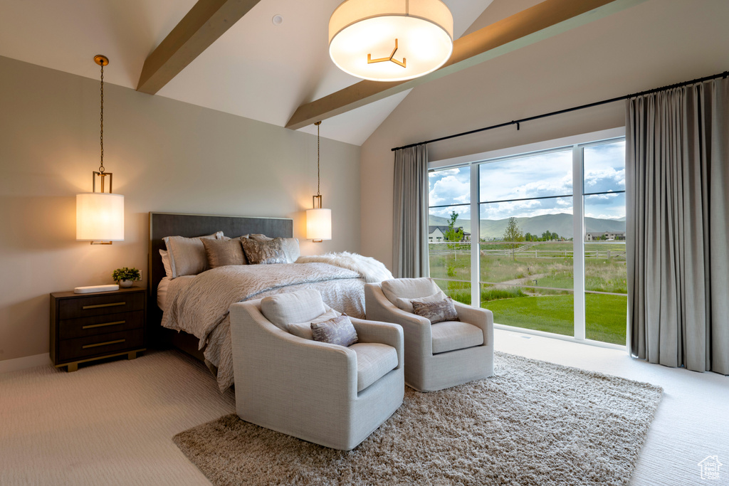 Bedroom featuring light colored carpet, high vaulted ceiling, a mountain view, beamed ceiling, and access to exterior