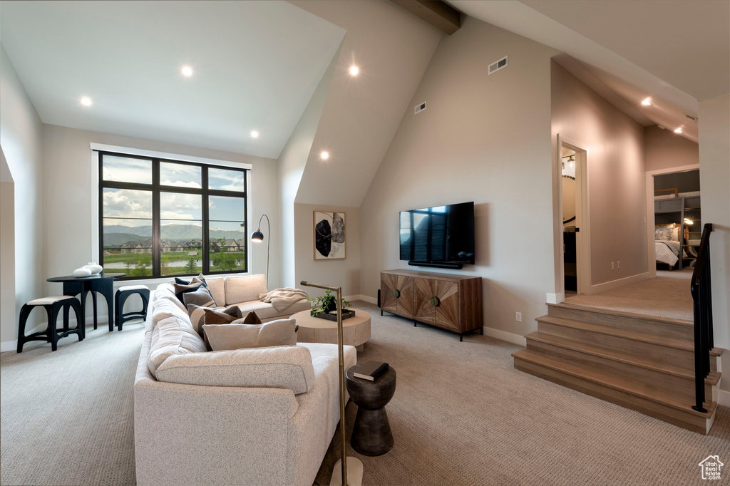 Living room featuring light colored carpet, recessed lighting, stairway, high vaulted ceiling, and beamed ceiling