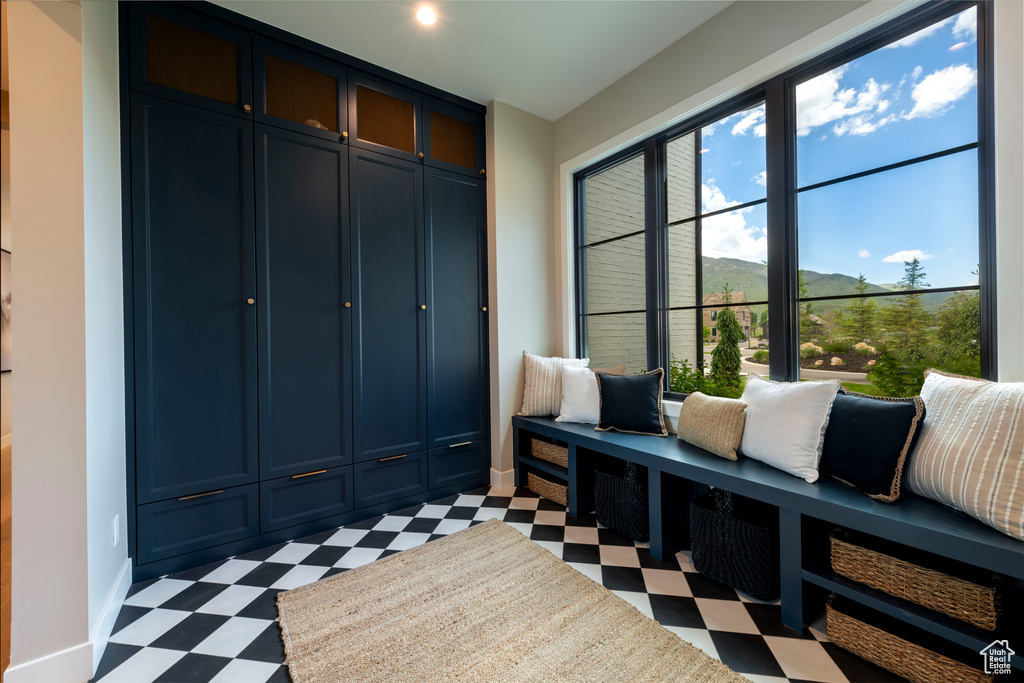 Mudroom featuring light flooring and a mountain view