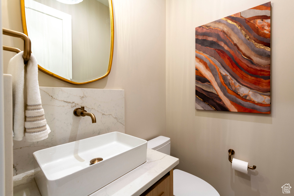 Bathroom featuring toilet and vanity
