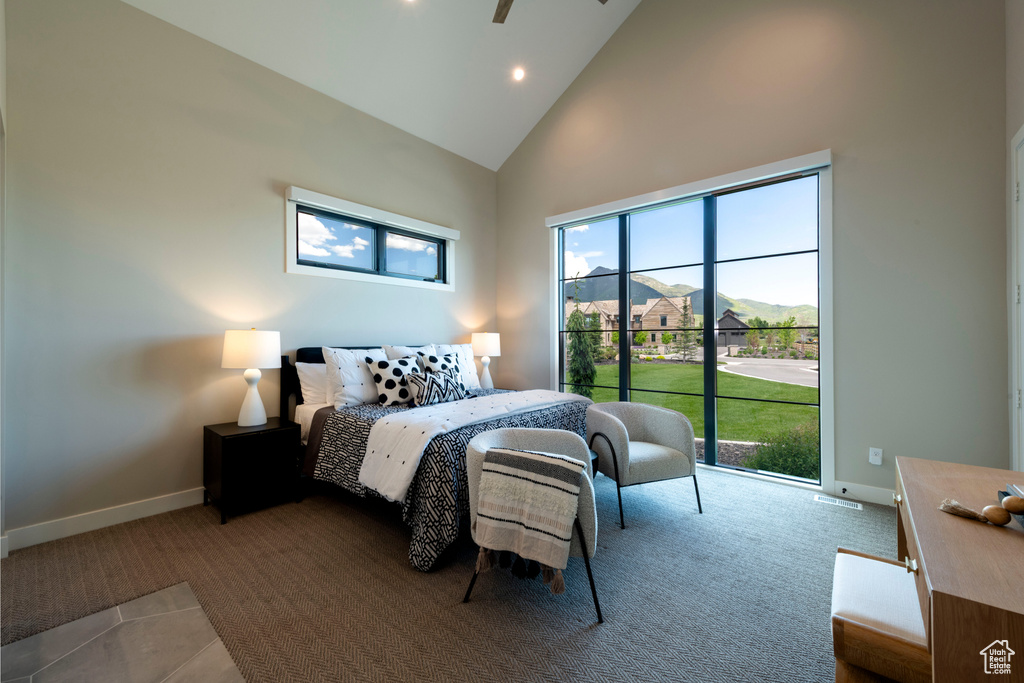 Carpeted bedroom featuring high vaulted ceiling, recessed lighting, and access to outside