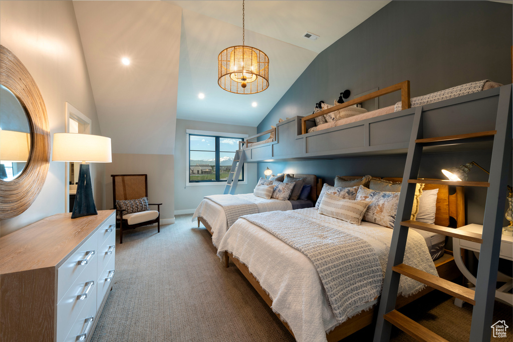 Bedroom featuring vaulted ceiling, carpet, a chandelier, and recessed lighting