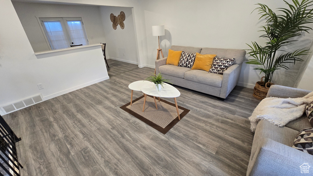 Living room featuring wood finished floors and baseboards