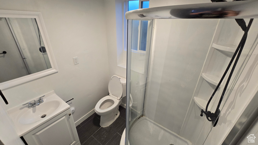 Bathroom featuring vanity and a shower stall