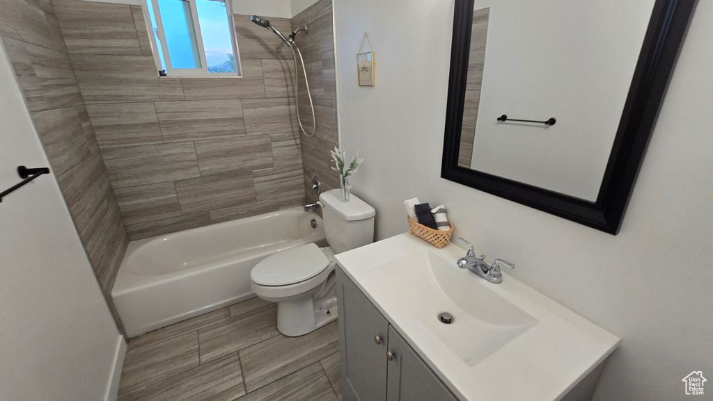 Bathroom with vanity and tub / shower combination