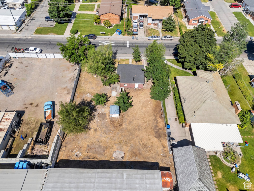 Aerial view of property and surrounding area with nearby suburban area
