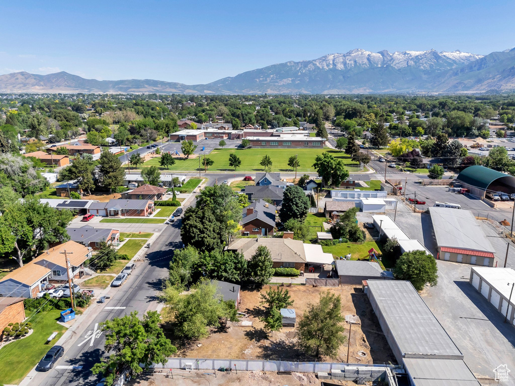 Aerial perspective of suburban area with a mountainous background