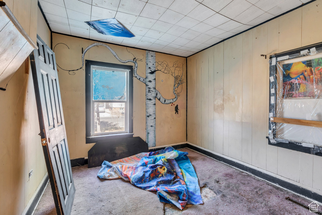 Empty room with wood walls