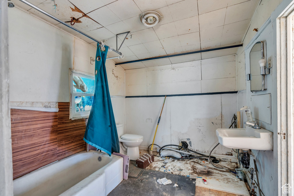 Full bathroom with toilet and shower / bath combo