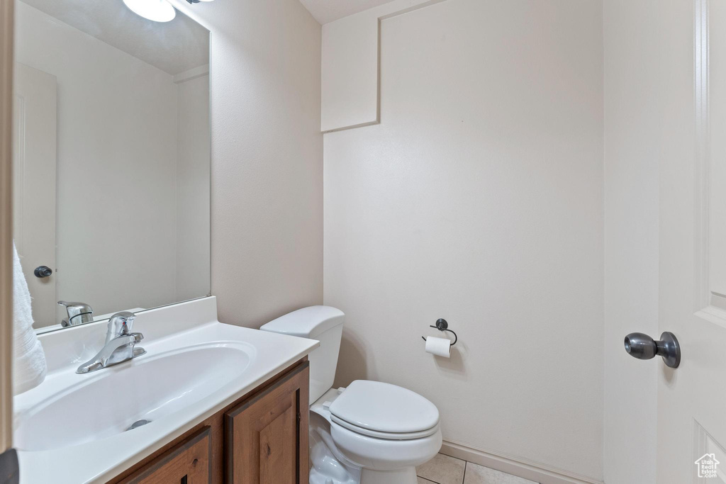 Bathroom with vanity and tile patterned flooring