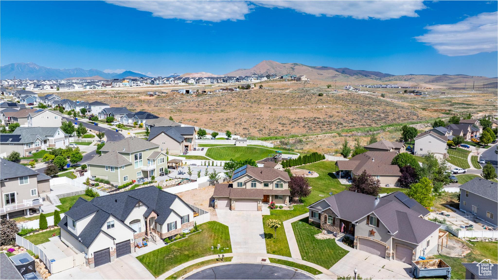 Aerial view of residential area with a mountainous background