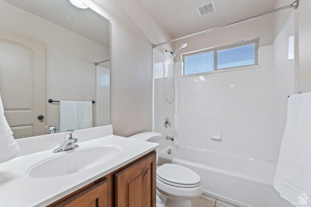 Full bath featuring  shower combination, vanity, and tile patterned floors