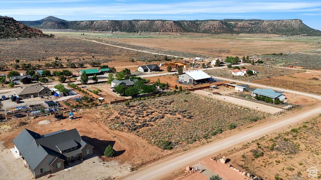 Aerial view of sparsely populated area with a mountainous background