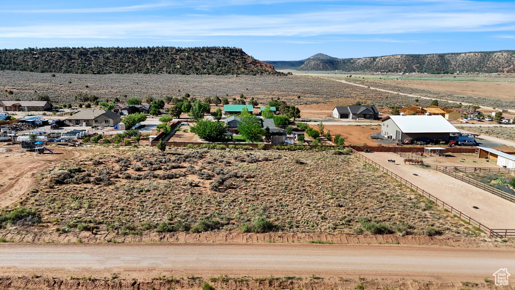 View of mountain backdrop with rural landscape