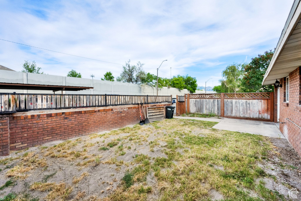 View of fenced backyard