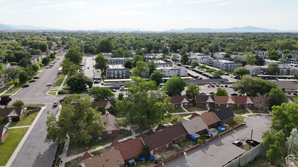Aerial view of residential area featuring a mountain backdrop